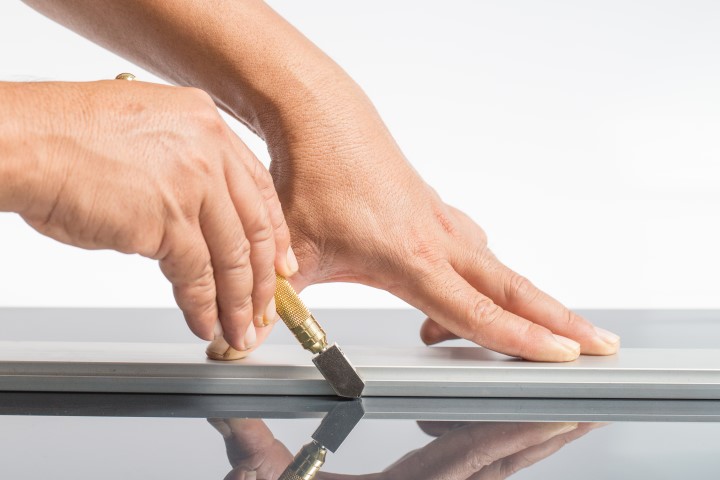 photo of glass cutting with a glass cutter