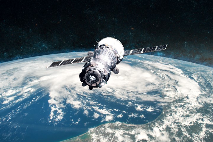 photo of satellite equipped with solar panels