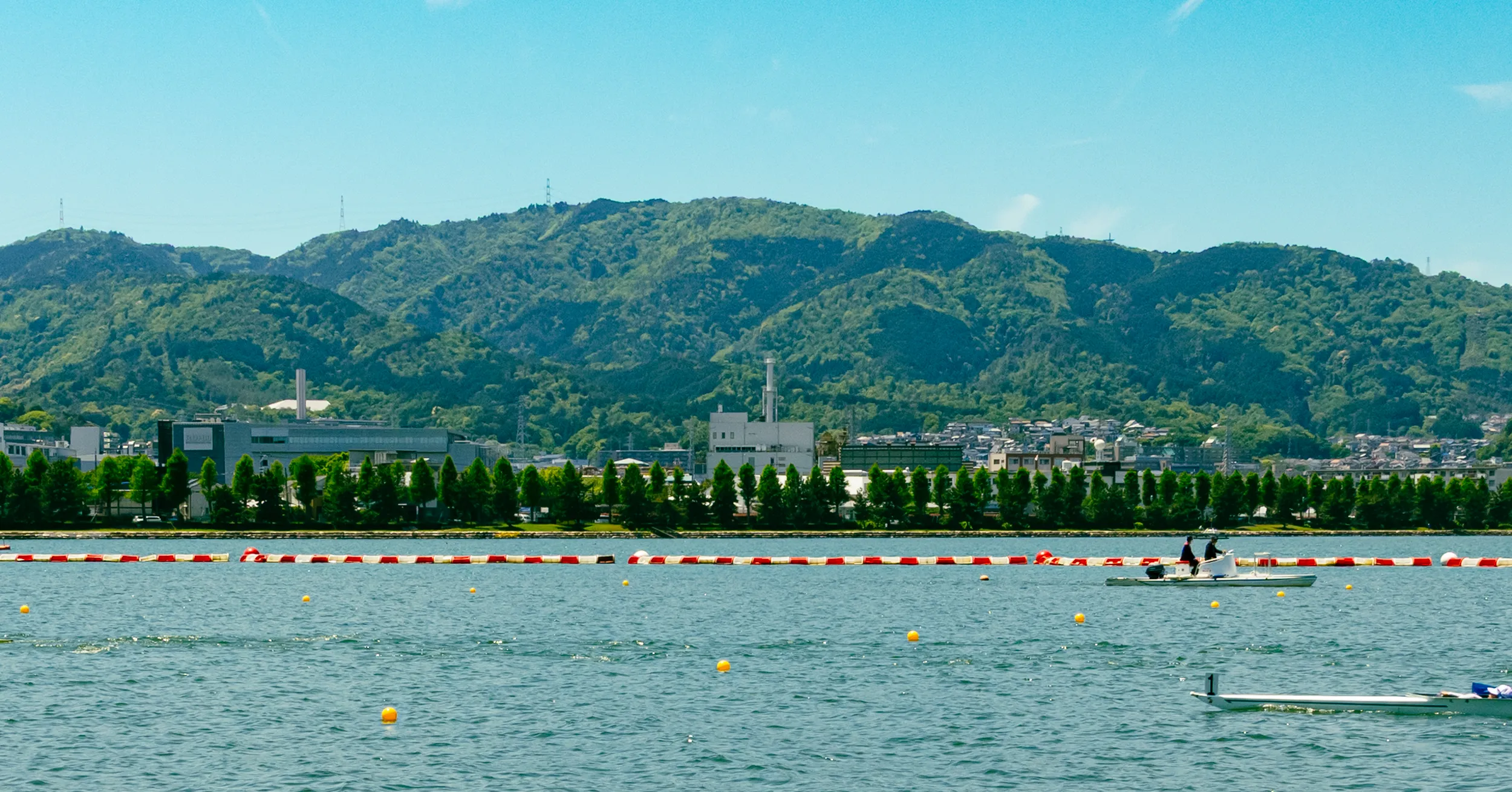 NEG's head office and Otsu plant seen across the shore of Lake Biwa